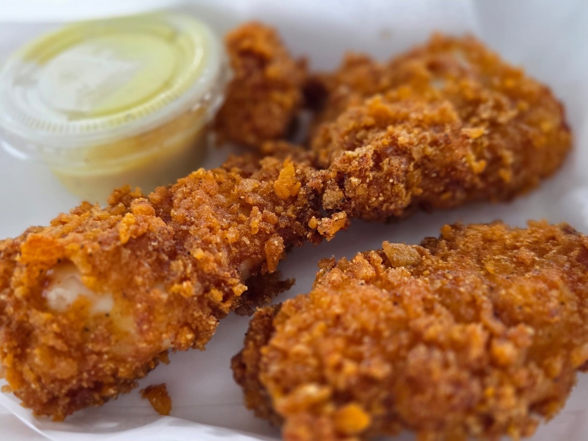 Cap’n Crunch–crusted chicken tenders with a cup of honey mustard